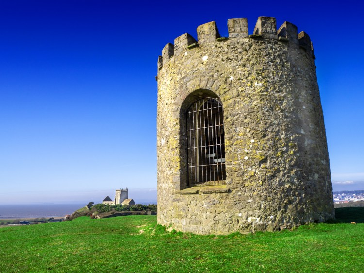 Uphill church of St Nicholas and the old tower windmill looking out over the Bristol Channel by French travel guide book writer