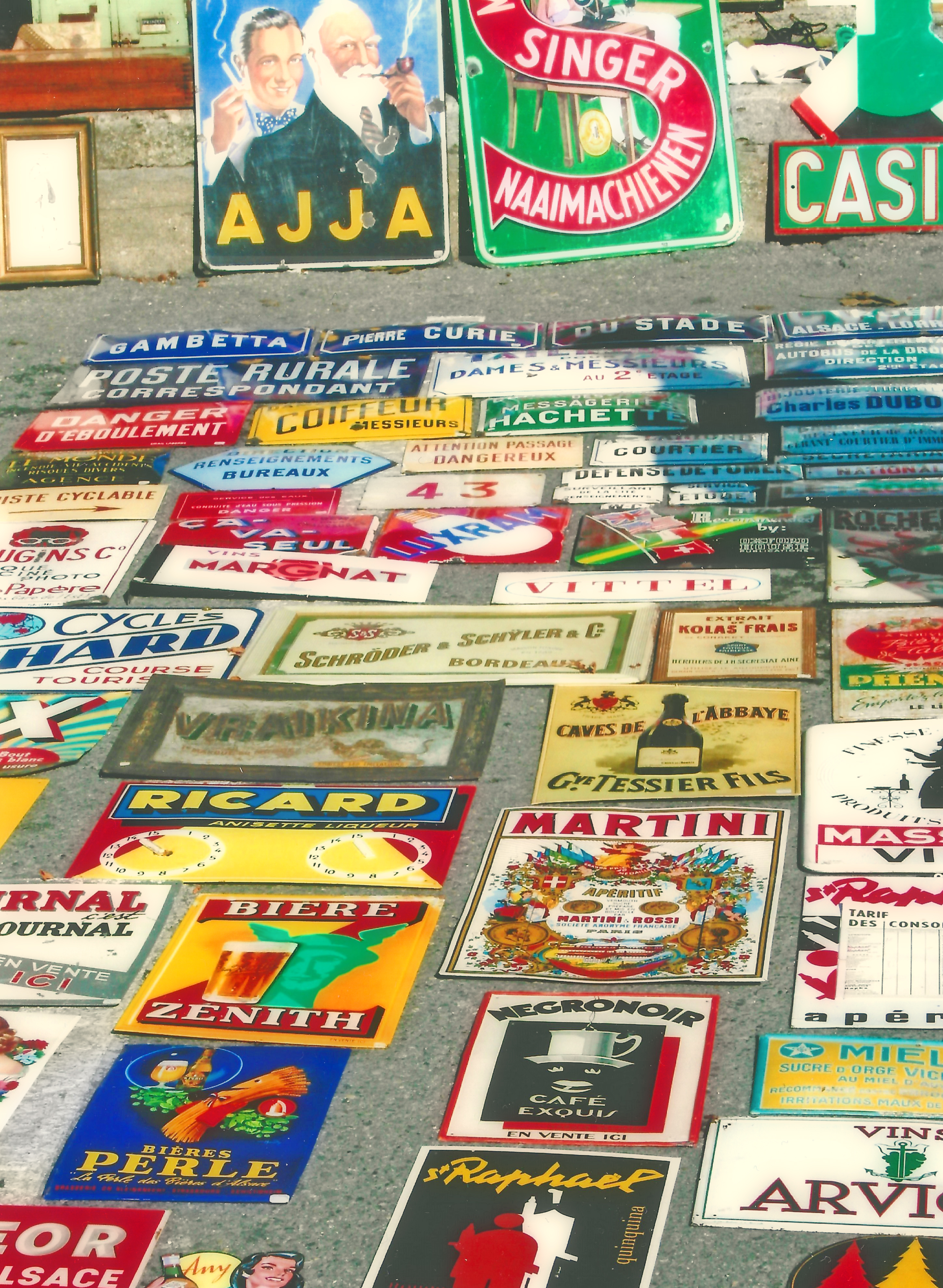 alt="french enamel signs on a market stall~