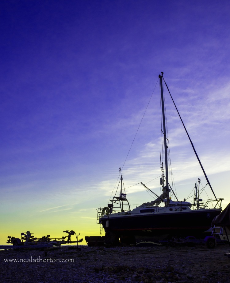 Alt="Photo of a yacht on Lyme Regis beach"