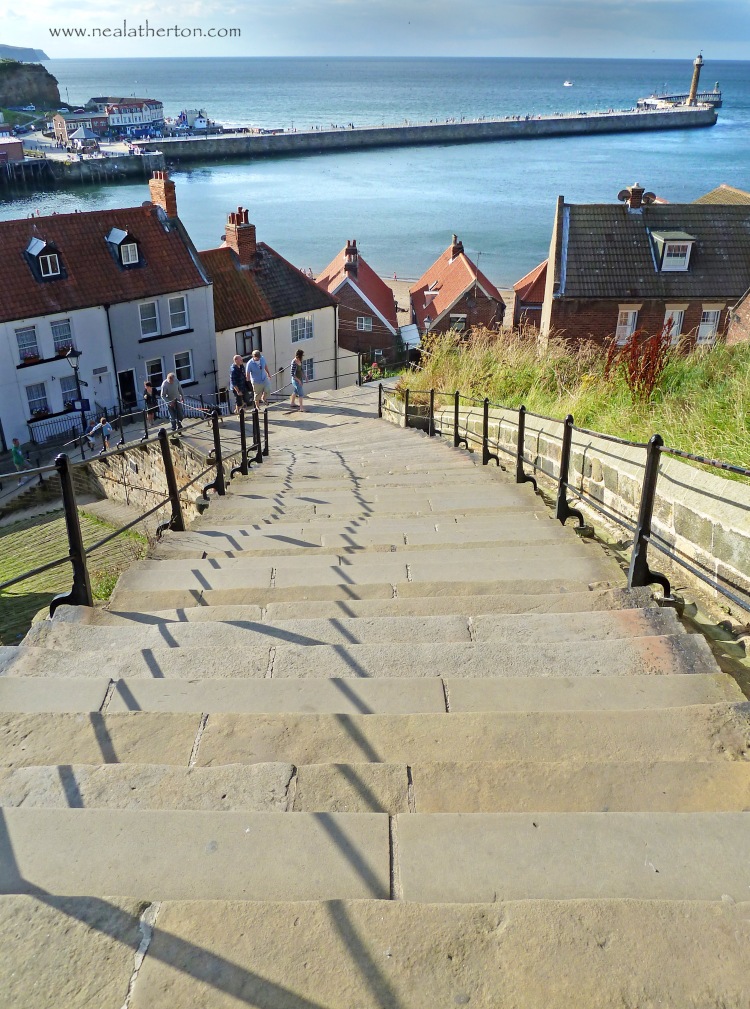 Alt="the steps leading up to Whitby church and Abbey ruins"