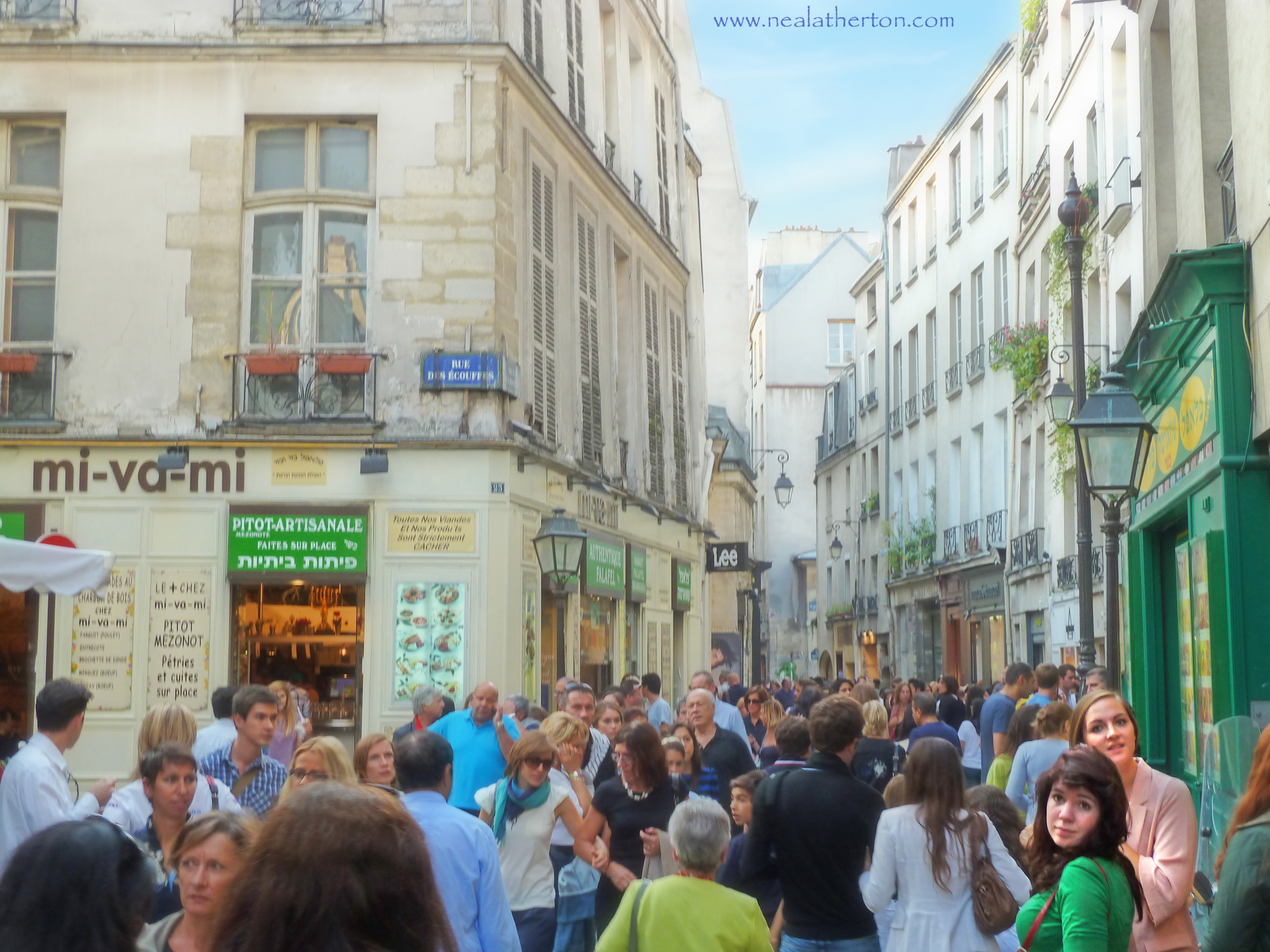 Alt="The Rue des Riosiers on a busy Sunday in the Marais district Paris France"