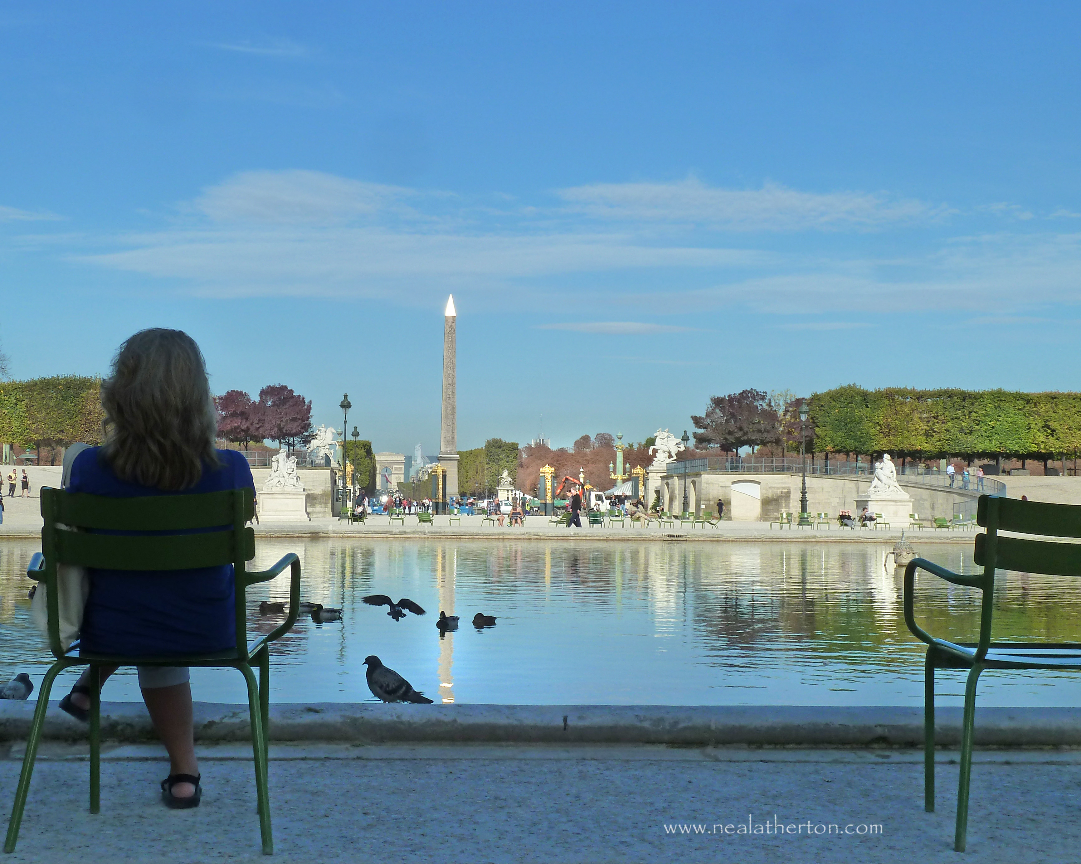 Alt="Pausing to enjoy the Paris view from the Jardin des Tuileries"