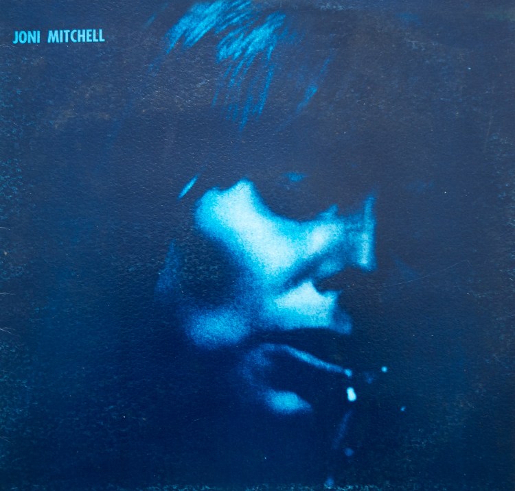 Joni Mitchell wrote and recorded Blue in 1970 and it is one of the greatest album of all time, the cover is a perfect capture of the mood expressed on the vinyl record