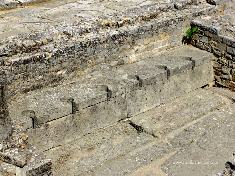 Six Roman stone toilets in the ruins at Vaison la Romanine in Provence France