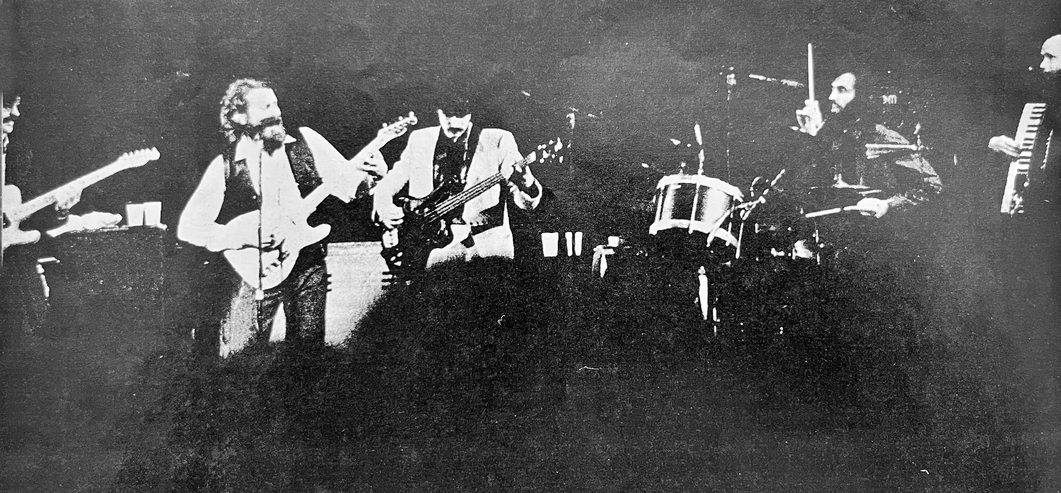 Black & White photo of The Band taken in 1974 featuring Robbie Robertson, Garth Hudson, Levon Helm, Rick Danko & Richard Manuel