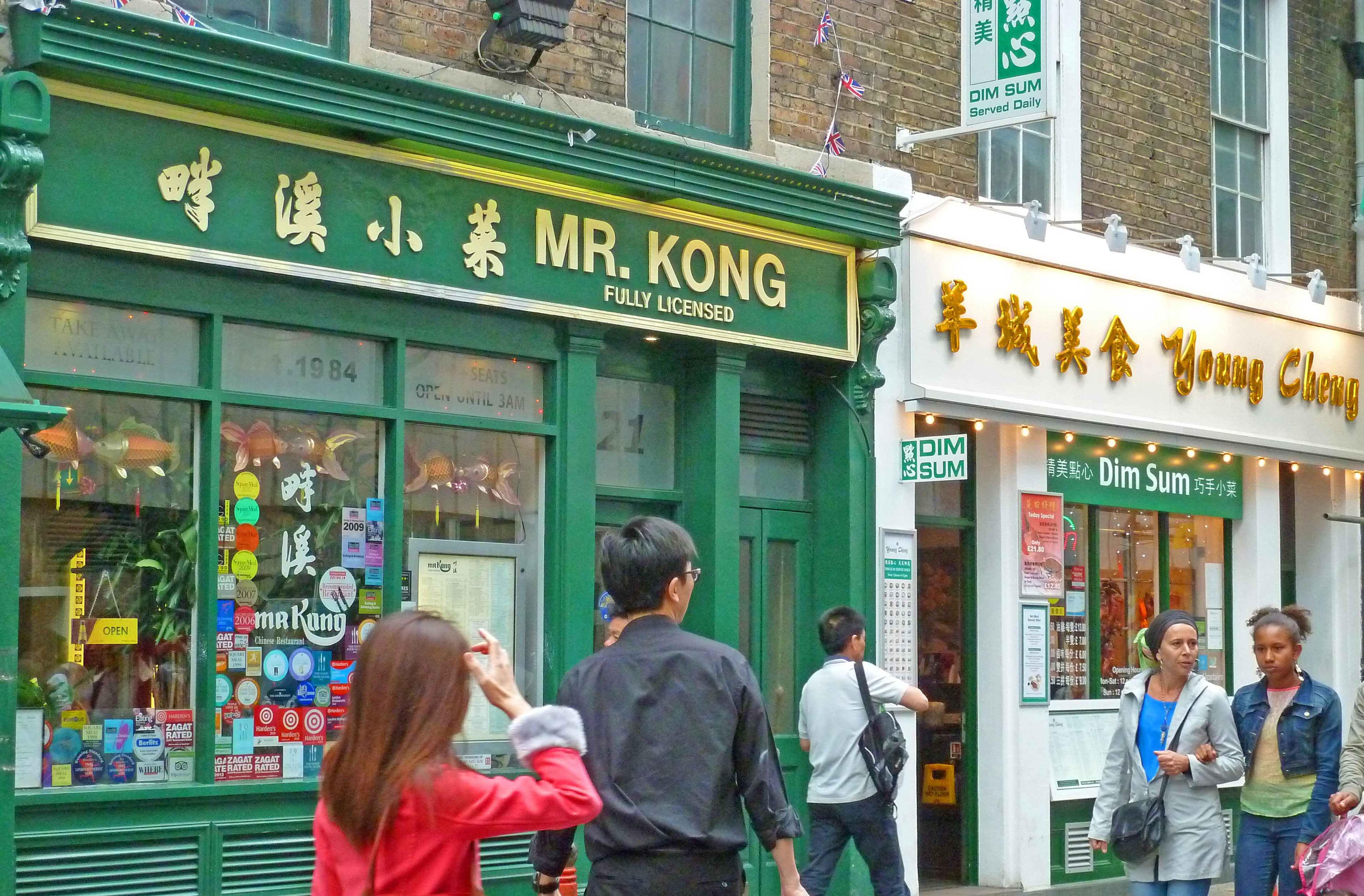 People walking in front of chinese restaurants in London