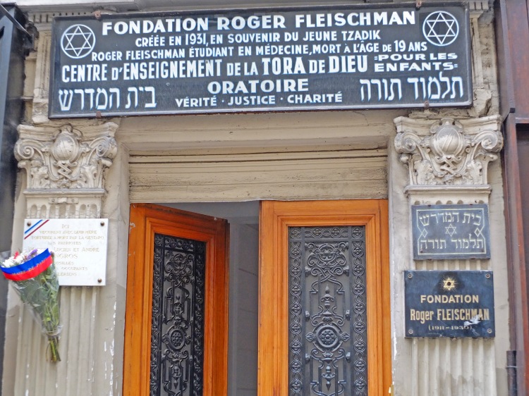 jewish hebrew sign with wooden metal doors and flowers