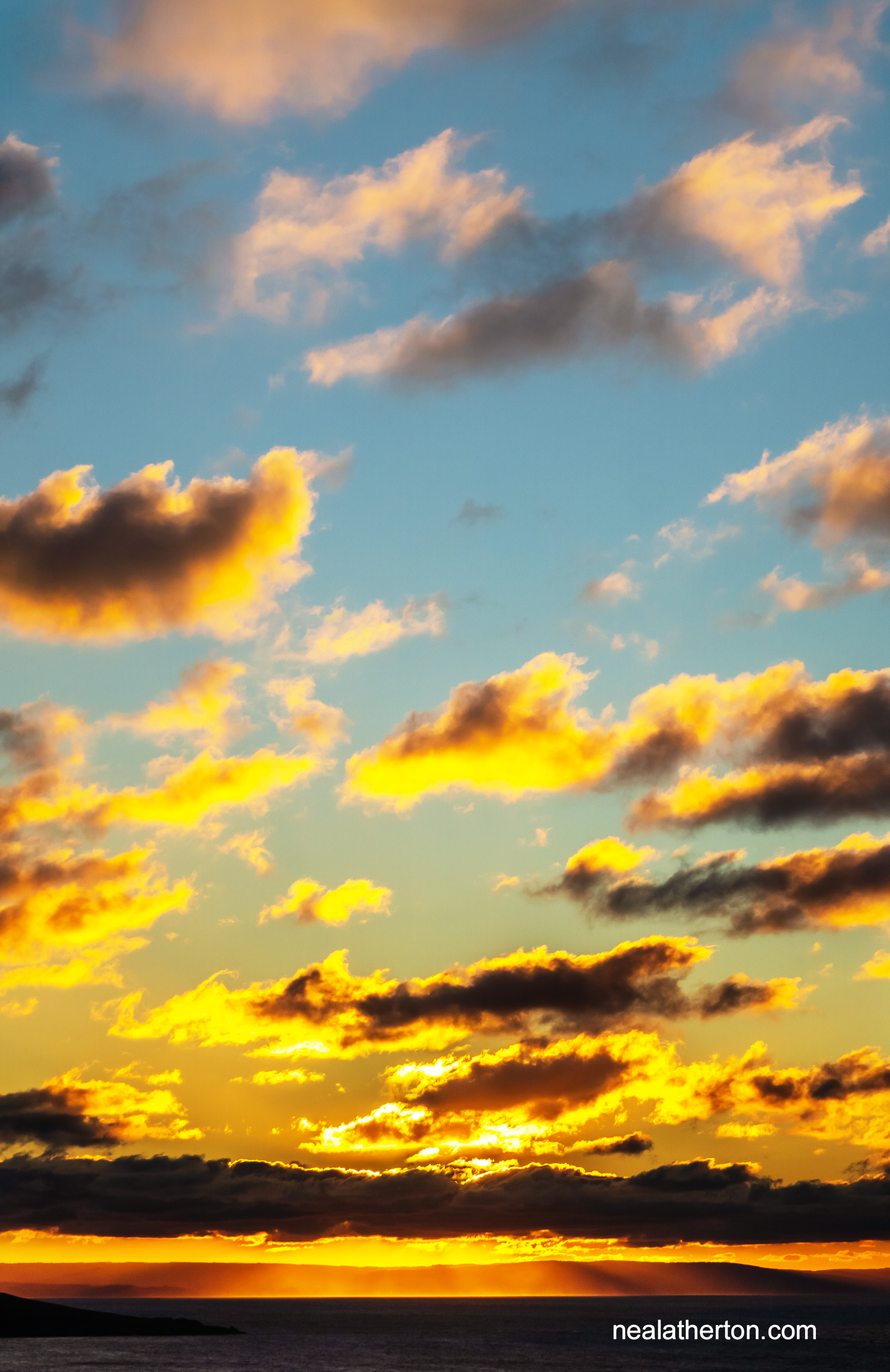 clouds illuminated by the setting sun over North Somerset coast and Weston Bay