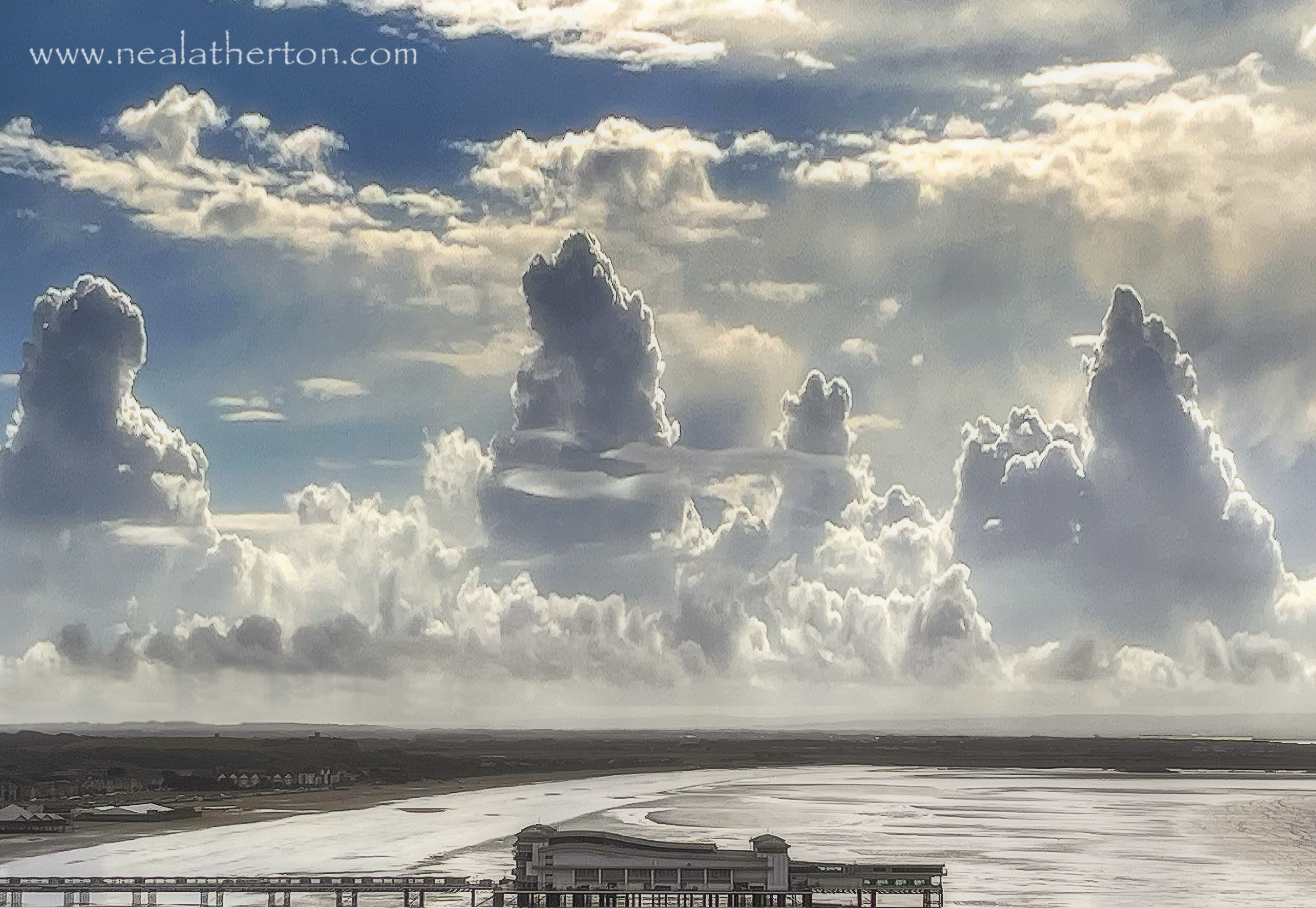 Weston super mare pier in front of strange clouds over Brean Somerset